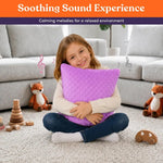 A child hugs the Purple and Grey Dual Sided Vibrating Pillow.
