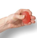 A hand squeezes the red Hand and Finger Grip Strenghener Egg Shaped Stress Ball.