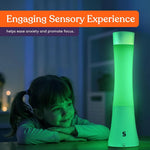 A child looks at the green illumination of the Light Lava Lamp.