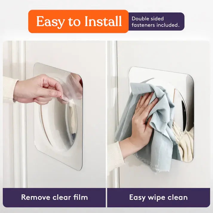 A hand removes the protective film on the Sensory Bubble Wall Mirror and wipes it with a rag.