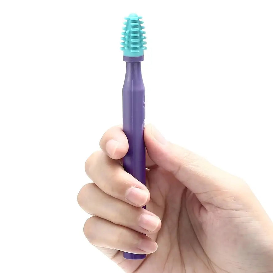 A hand holds up the Silicone Sensory Brush and Oral Stimulation Tool.