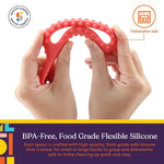 A pair of hands bends the red Textured Duo Spoon Loop to demonstrate its flexibility.