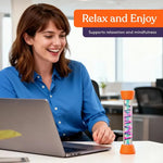 An adult takes a break at work by watching the oil fall in one of the Textured Sensory Tubes.