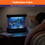 A child sleeps next to the calming glow of the  Special Supplies Vintage Aquarium Sensory Fish Lamp.