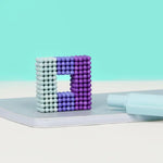 A square 3D design of the Speks 432 Fidget Magnets - Bold Mix, Audacious.