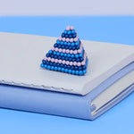The Speks 432 Fidget Magnets - Bold, Valiant molded into a pyramid.