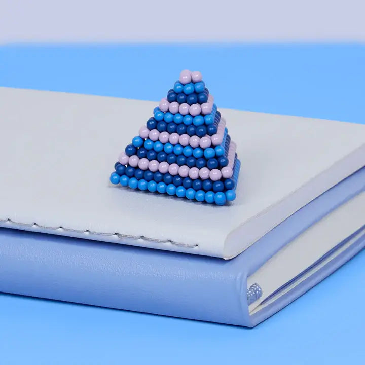 The Speks 432 Fidget Magnets - Bold, Valiant molded into a pyramid.