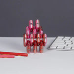 Pieces of the Stellar Speks Geode Chrome are stacked in a design.