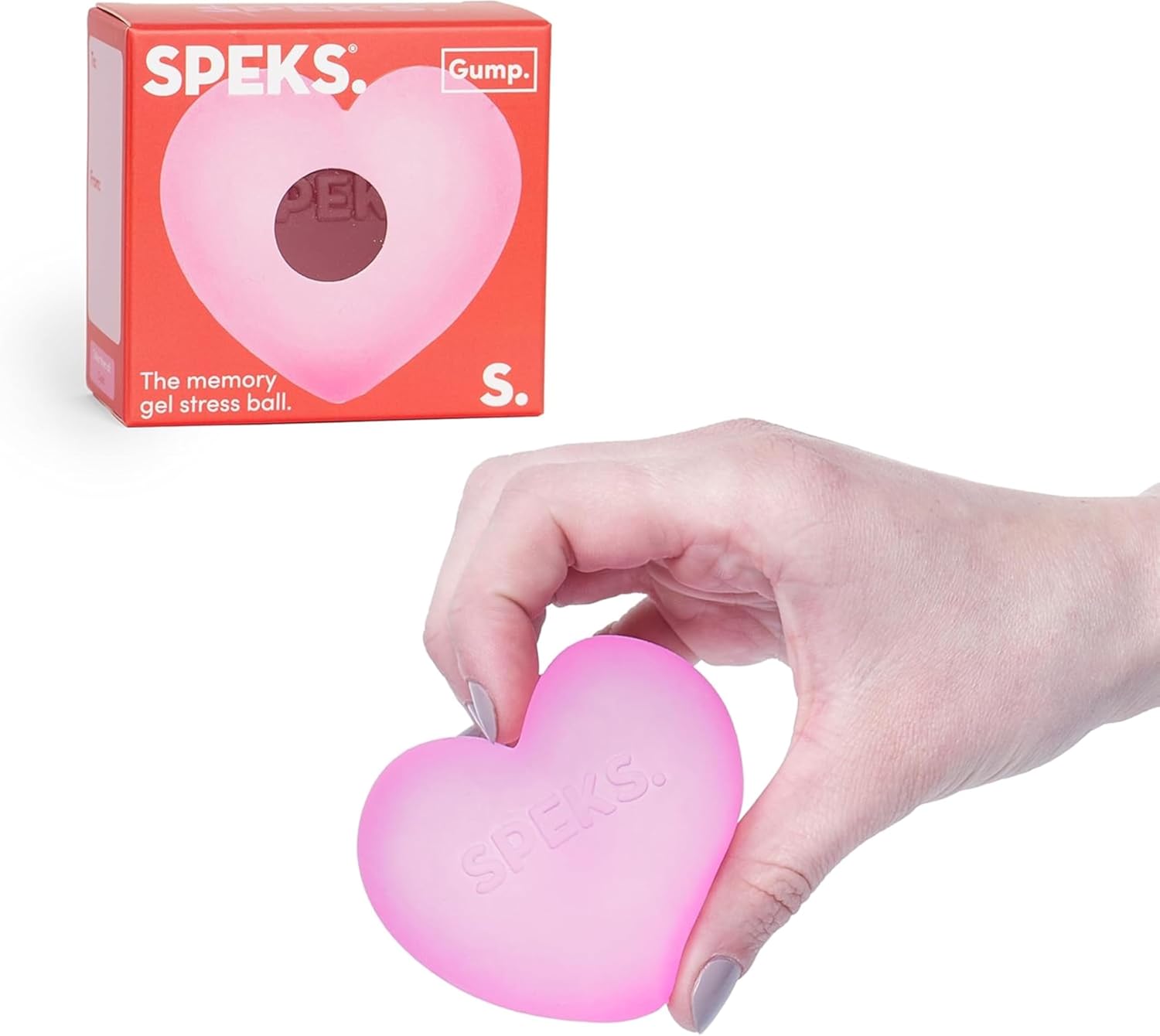 A hand holds the pink Speks Gump Heart Gel Stress Ball in front of its product package.