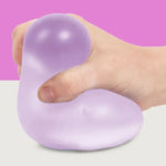 A hand squishes the Mist Speks Gump Jumbo Gel Stress Ball.