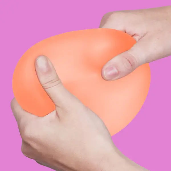 Two hands pull on the Reef Speks Gump Jumbo Gel Stress Ball.