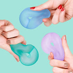 Three different hands squish and squeeze and three different colors of the Speks Gump Loop Cool 3-Pack.