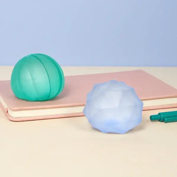 The Speks Gump Surface Cool 2-Pack spread out in a desktop setting.