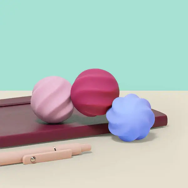 Three Speks Odds Vivid Pink Swirl Cascade down a notebook.