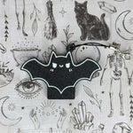 The Spicy Bat Tab Buddy with its keychain.