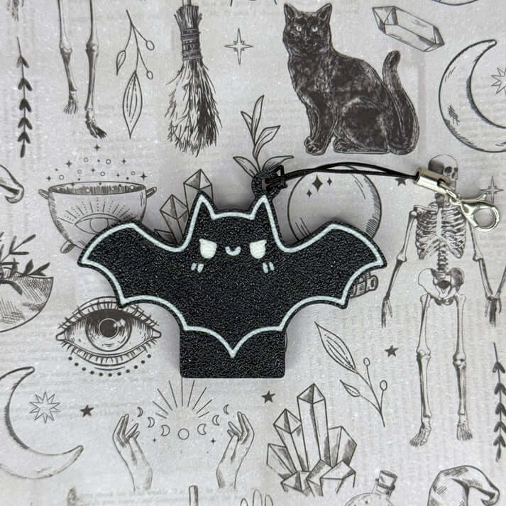 The Spicy Bat Tab Buddy with its keychain.