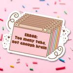 The "ERROR: Too many tabs, not enough brain" vinyl sticker on a pink background with rainbow sprinkles.