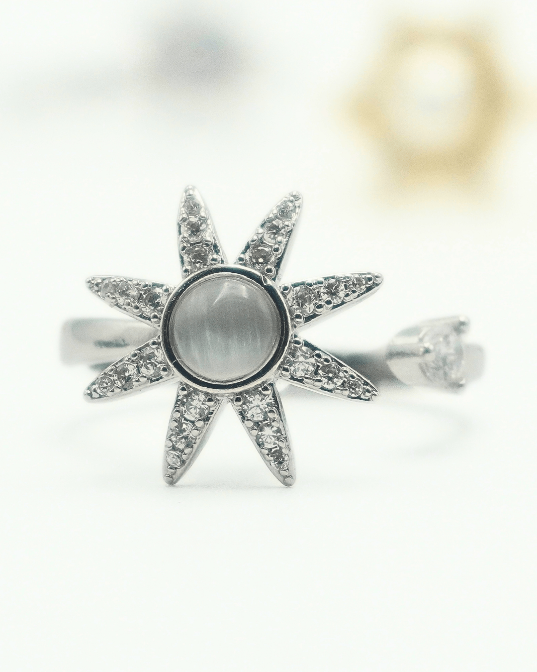 Star Moonstone Fidget Spinner Ring in Copper with Cubic Zirconia.