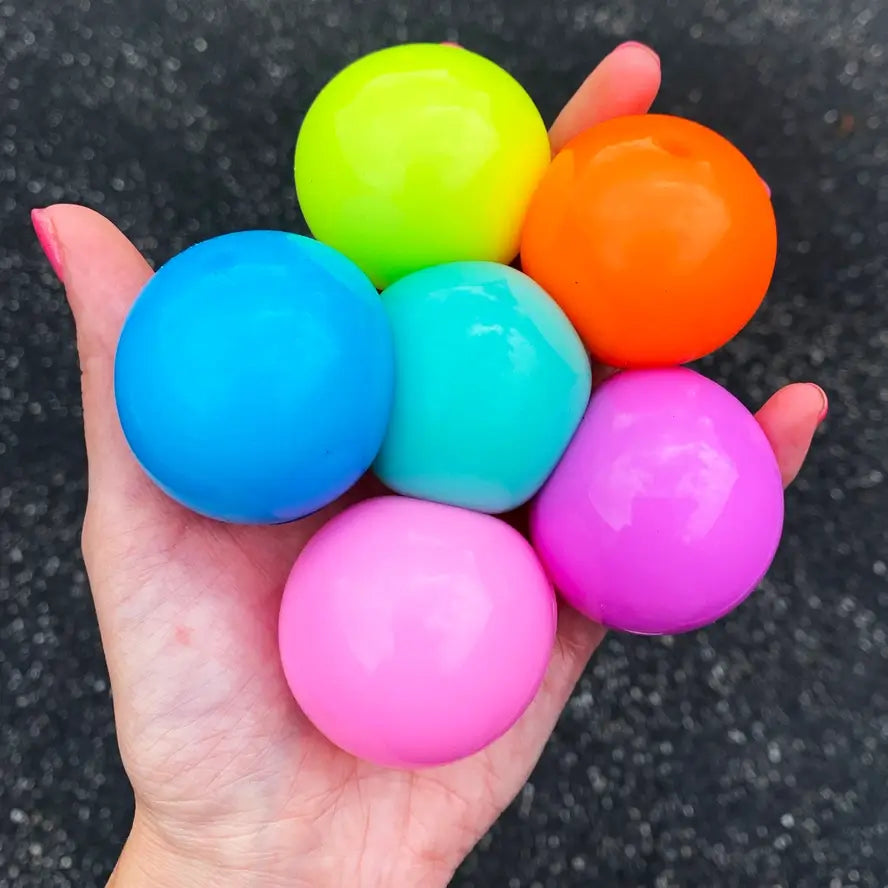 A hand holds up six Sticky Bubble Blobbies.