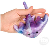 The purple Sting Ray Sandbag in a hand with light skin tone.