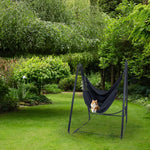 A cat relaxes on the Polycotton Hamock Chair A-Frame Steel Stand.
