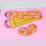 THe Really Pretty Florals Cooling Weighted Neck Wrap - 2 lb next to an eye mask with the same pattern.