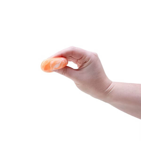 A hand squeezes the orange Teenie NeeDoh Swirl.