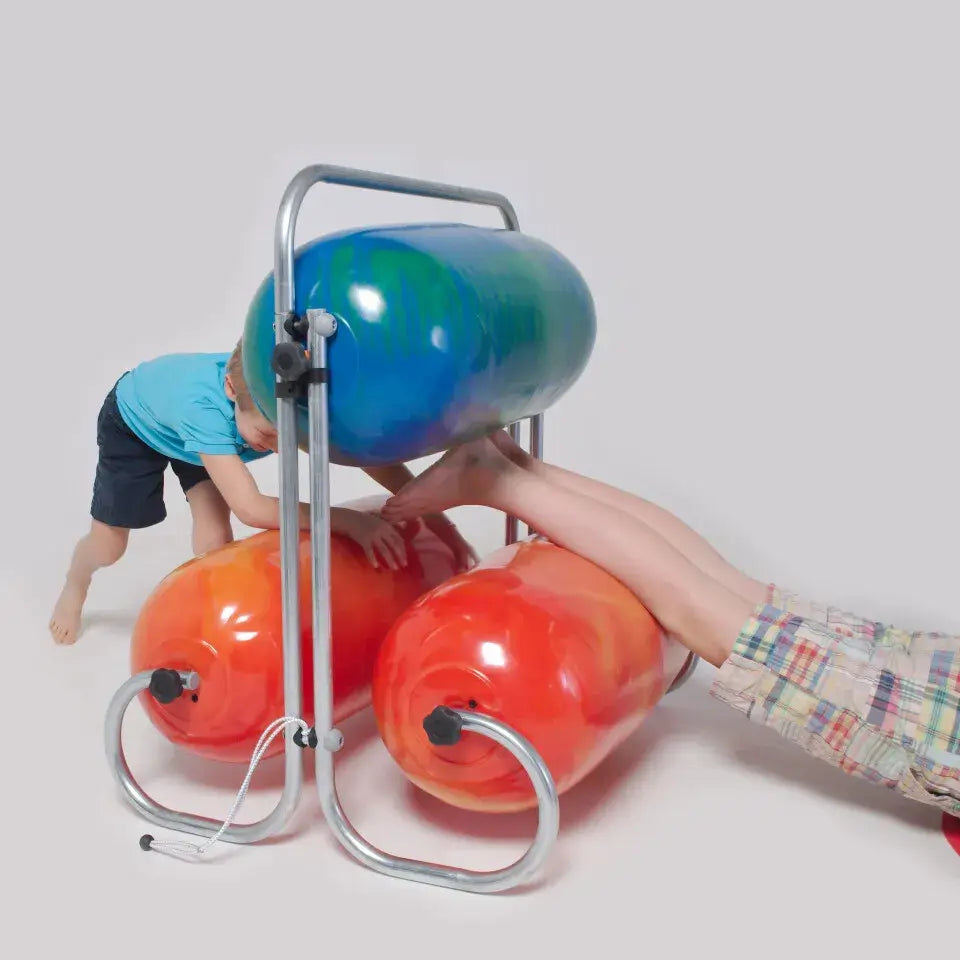 A child exists the A child rolls through the TFH Squeeze Machine, while another starts to work his way through.