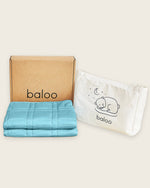 The free tote and box that are shipped with the Mini Baloo Weighted Blanket in Aqua.
