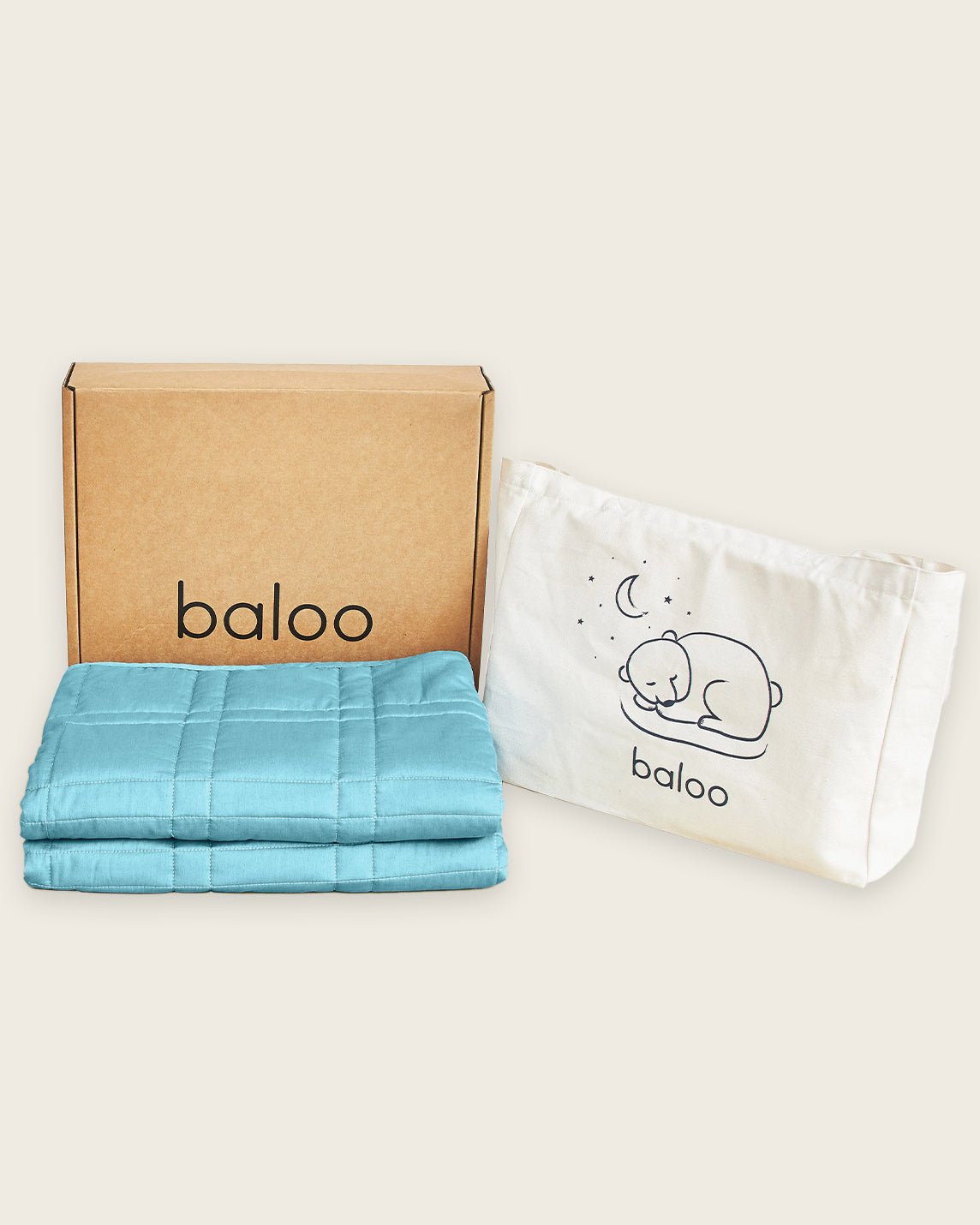 The free tote and box that are shipped with the Mini Baloo Weighted Blanket in Aqua.