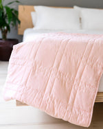 The Petal Pink Baloo Mini Weighted Blankets.