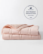 The Petal Pink Baloo Mini Weighted Blanket.