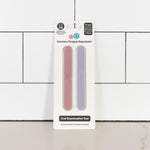 The Blush and Pewter Tongue Depressor Set in its product package.