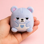 A blue bear Super Duper Sugar Squisher Mini looks moody.