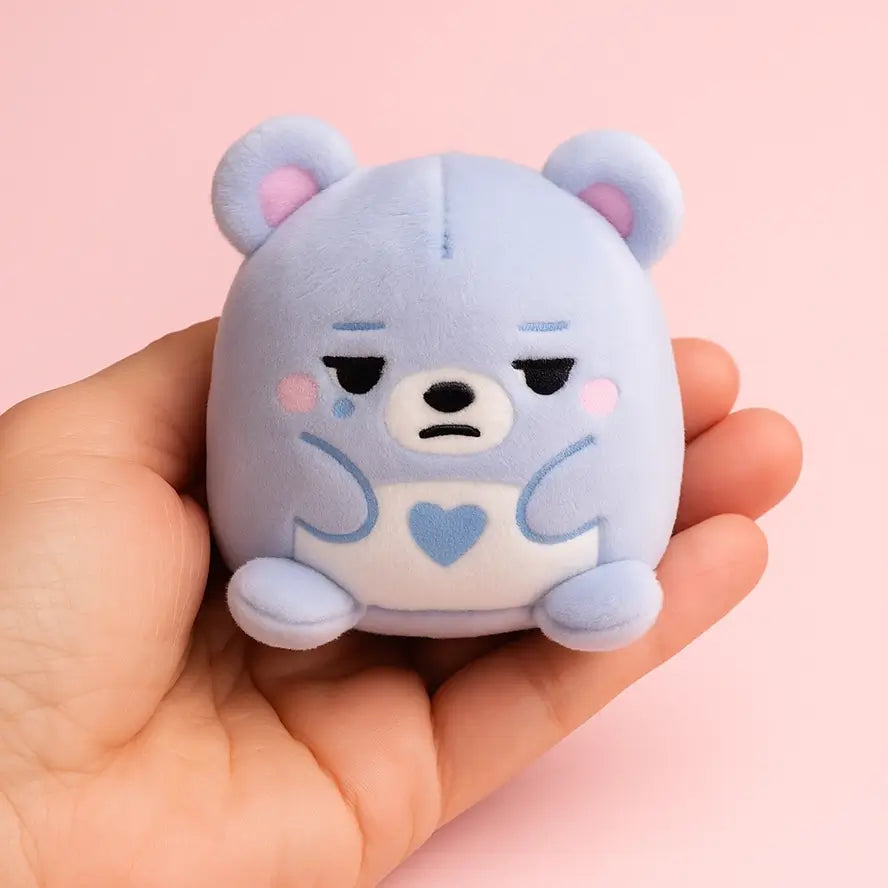 A blue bear Super Duper Sugar Squisher Mini looks moody.