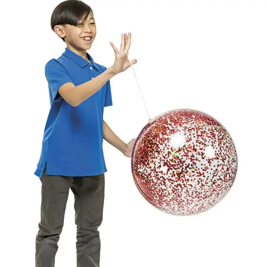 A child plays with the Red YAY! Punch Balloon.