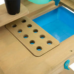 A close-up of the TP Toys Wooden Explore Potting Bench Outdoor Playset.