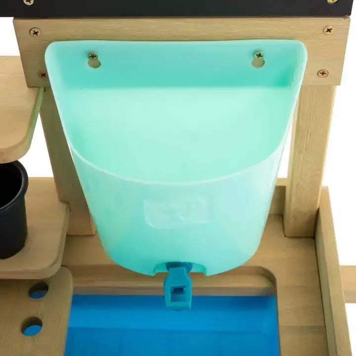 A close-up of the water butt on the TP Toys Wooden Explore Potting Bench Outdoor Playset.