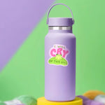 The "I Will Cry On This Hill" sticker on a water bottle.