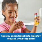 A child reads one of the conversation cards while squeezing the squishy pencil fidget.