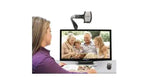 A woman magnifies a family photo on the Acrobat Ultra HD Low Vision Magnifier.