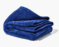 The navy Gravity Weighted Blanket (35 lbs).