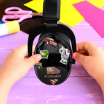 A child decorates their Black Adjustable Noise Reducing Earmuffs with stickers.