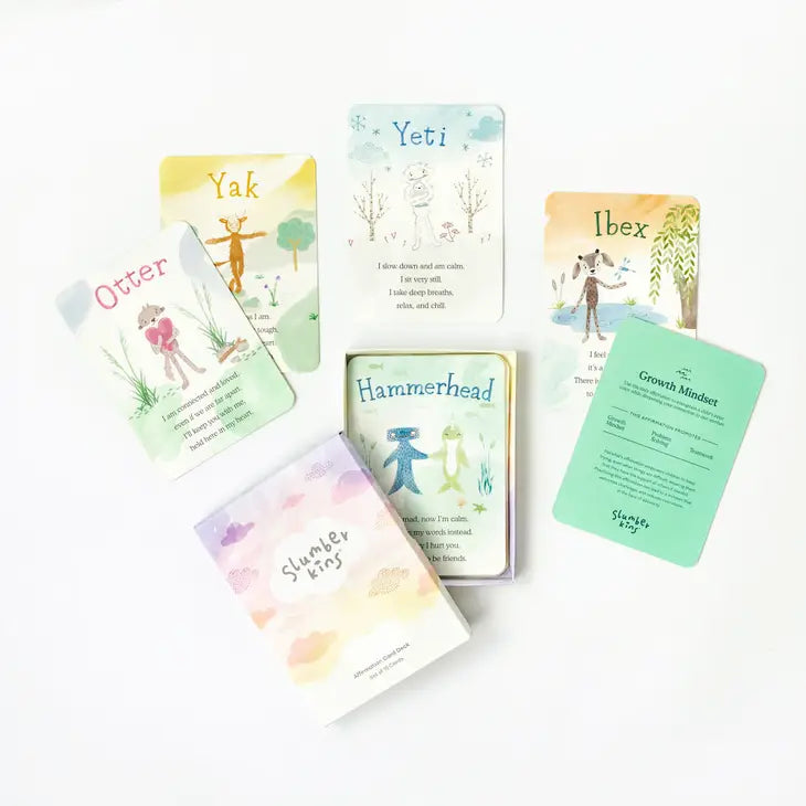 A display of four of the Slumberkins Affirmation Cards and the product box.