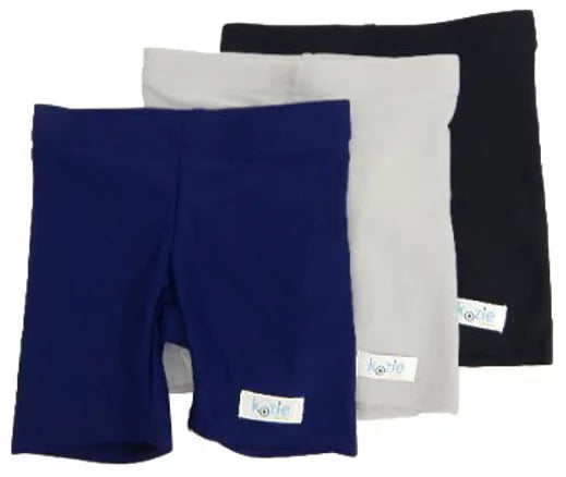 A display of three pairs of Kozie Unisex Sensory Compression Shorts in three different colors.