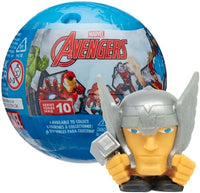 Toy Thor stands in front of the Smash'Em capsule.