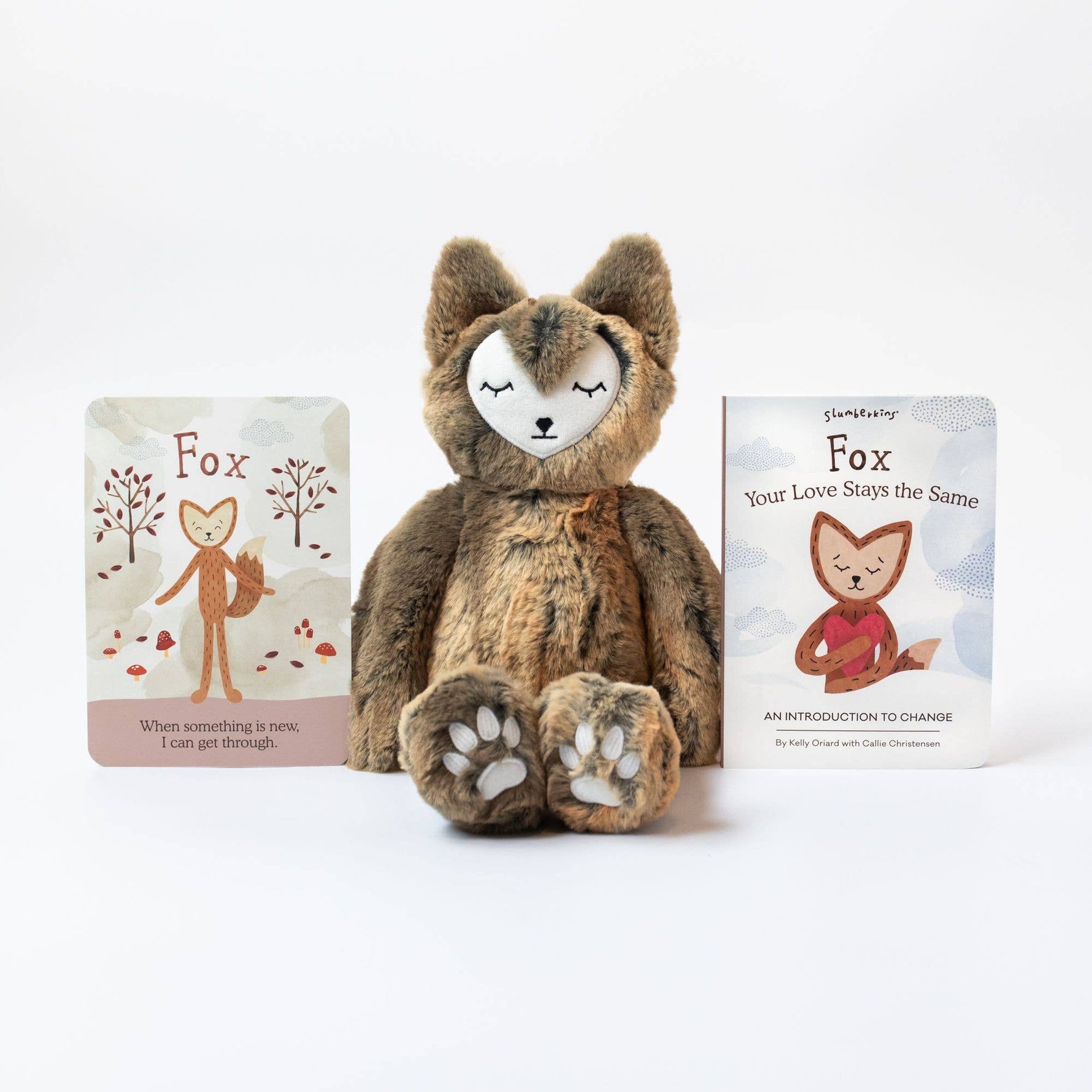 Slumberkins Woodland Fox Kin sits between the accompanying affirmation card and board book.