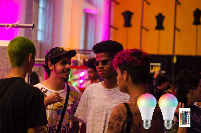 Several young people appear to be at a party with multi-color lights on in the background.