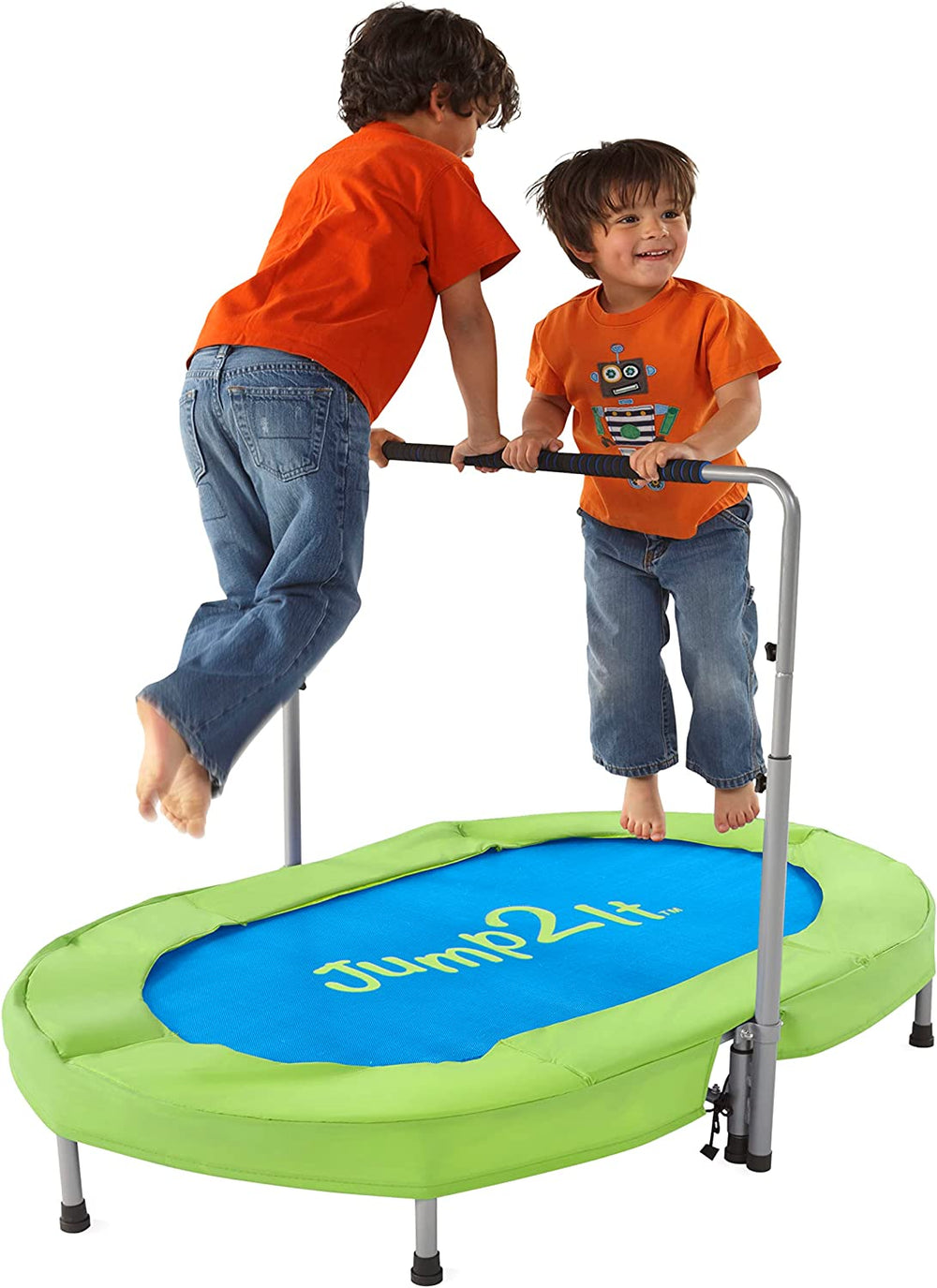 Two children with medium light skin tone and short brown hair are wearing orange t-shirts and jeans. One is on either side of the handlebars of the Jump2It Trampoline, holding on and in mid-air.