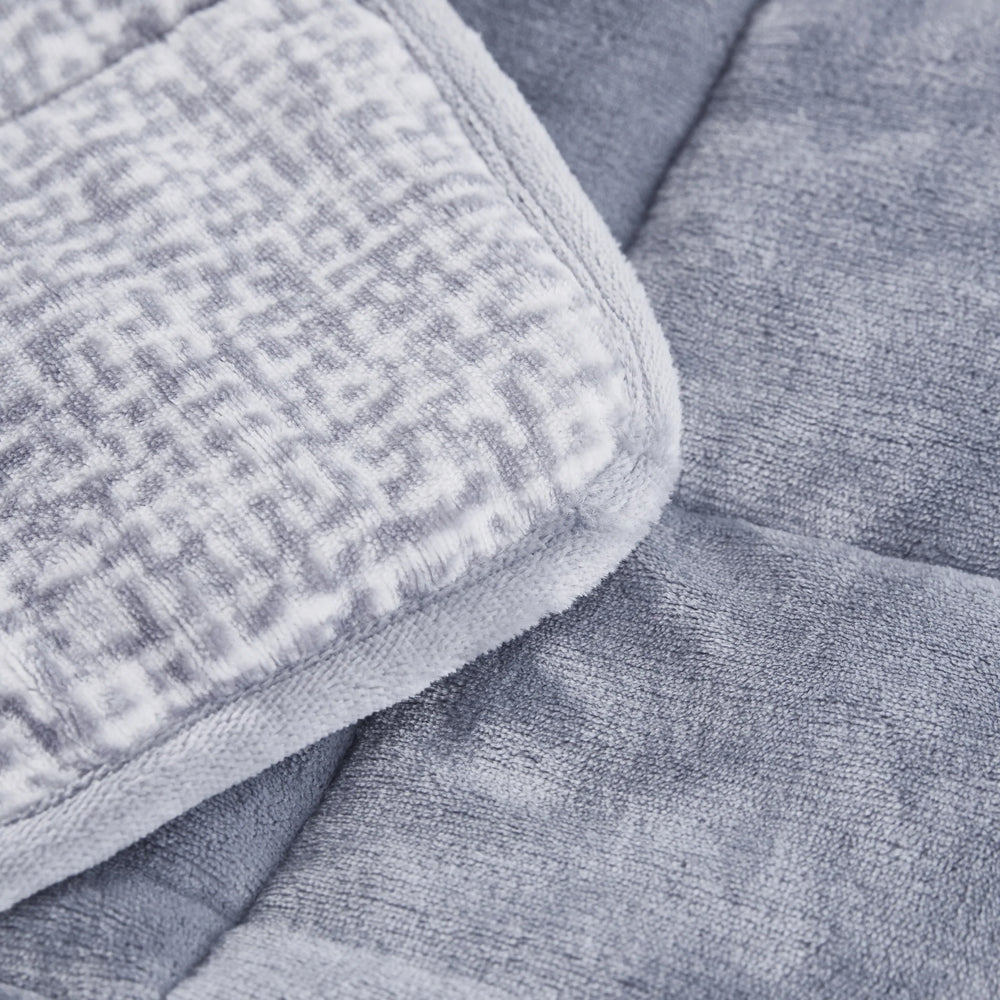 A close up of the texture of the Machine Washable Velvet to Velvet Weighted Throw.